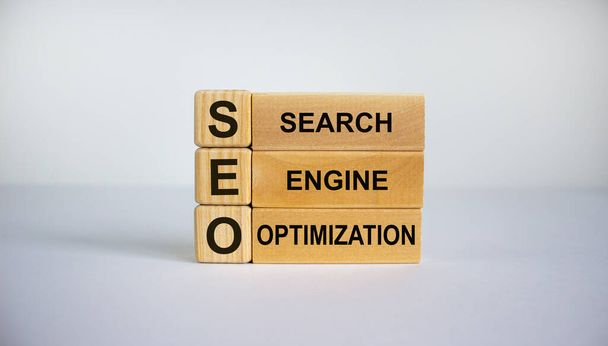 Concept words 'SEO, search engine optimization' on cubes and blocks on a beautiful white background. Copy space. - 写真・画像