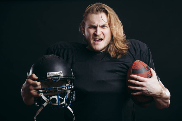 Rugby football player, with long hair over isolated background - Φωτογραφία, εικόνα