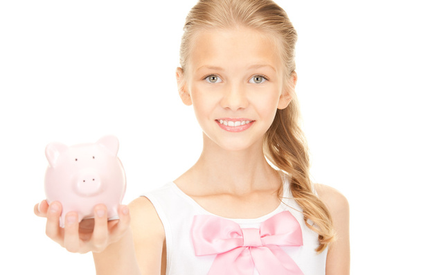 Lovely teenage girl with piggy bank - Foto, imagen