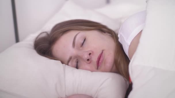 Young Woman Sleeping Well in Comfortable Cozy Bed on White Pillow Linen, Healthy Deep Sleep - Video, Çekim
