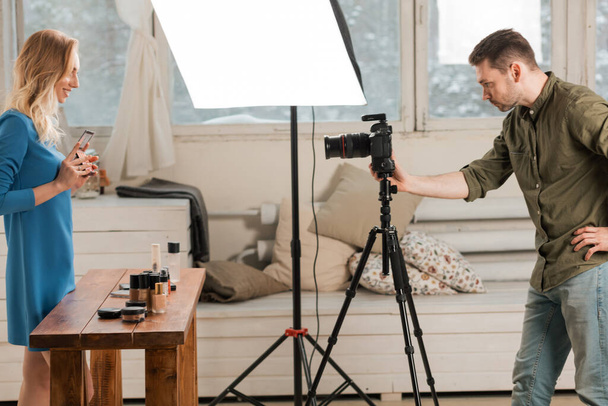 attractive female blogger shotting her video about cosmetics - Foto, immagini