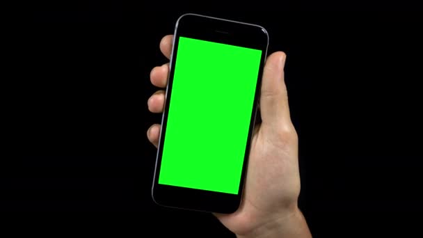 Vídeo de pessoa segurando telefone com tela verde
 - Filmagem, Vídeo