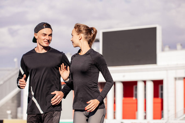 joyful man and woman spending time onn jogging - Photo, image