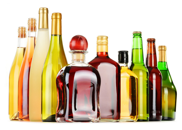 Bottles of assorted alcoholic beverages isolated on white - Photo, Image