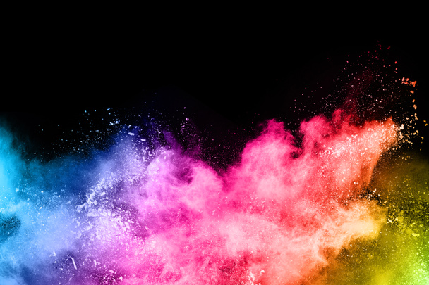 abstract colored dust explosion on a black background.abstract powder splatted background,Freeze motion of color powder exploding/throwing color powder, multicolored glitter texture. - Foto, immagini