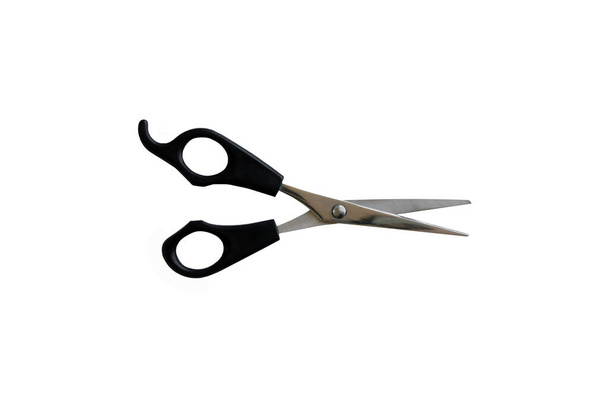 Tesoura de corte de cabelo profissional para cortes de cabelo isolados em um fundo branco
. - Foto, Imagem