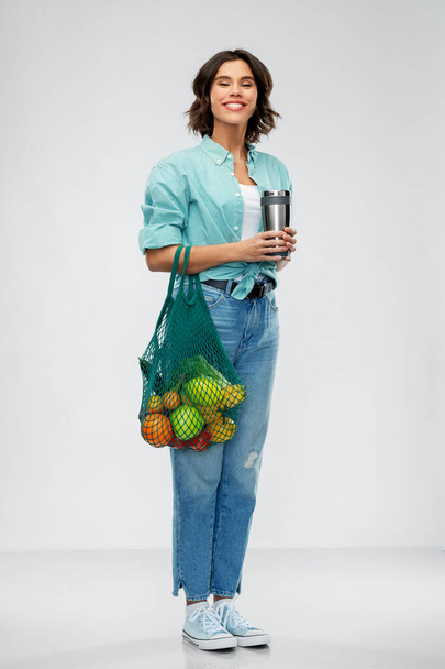 happy smiling woman with food in reusable net bag - Fotoğraf, Görsel