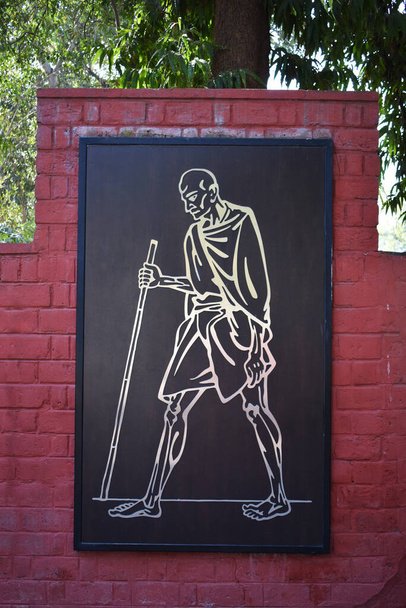 Mahatma Gandhi illustration on wall at Sabarmati Ashram or Gandhi Ashram, Ahmedabad, Gujarat, India - Photo, Image