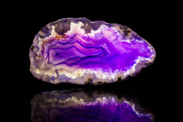 purple agate slice, black background, healing stone and mineral, reflection - Photo, Image