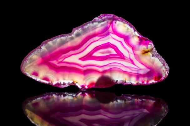 pink agate slice, black background, healing stone and mineral, reflections - Photo, Image