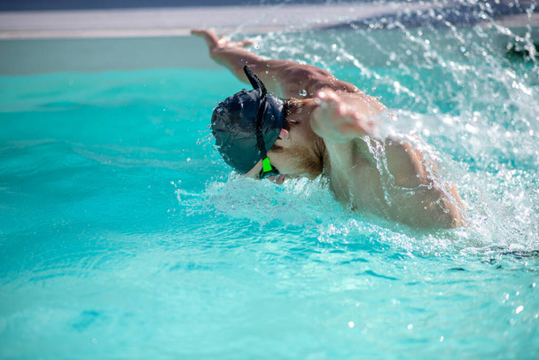 Swimmer throwing hands out of the water - Photo, Image