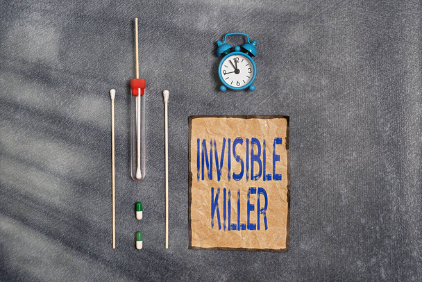 Conceptual hand writing showing Invisible Killer. Business photo text presence into the air of a substance which are harmful Set of medical equipment for health condition assessment. - Photo, Image