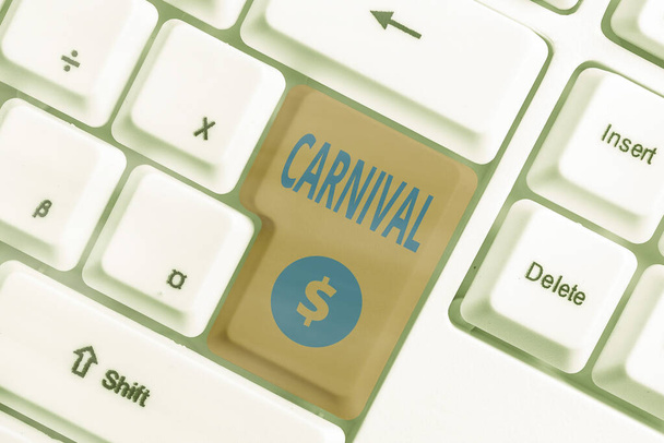 Handwriting text Carnival. Concept meaning traveling enterprise offering amusements, exhibitions, etc. Different colored keyboard key with accessories arranged on empty copy space. - Photo, Image
