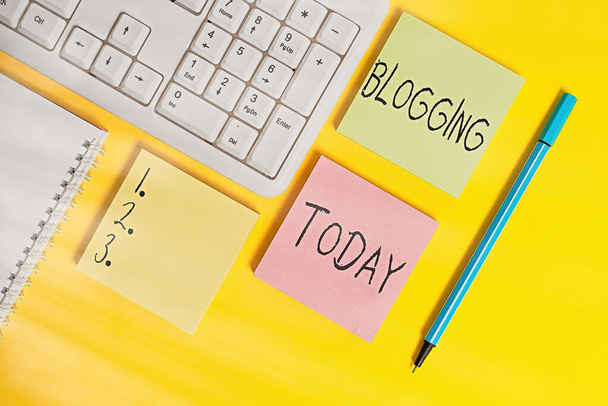 Conceptual hand writing showing Blogging. Business photo showcasing write something that contains online an individualal reflections Empty papers with copy space on yellow background table. - Photo, Image