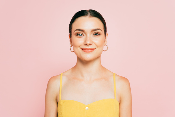 brunette young woman looking at camera isolated on pink - Photo, Image