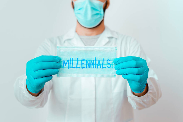 Writing note showing Millennials. Business photo showcasing an individual reaching young adulthood in the early 21st century Laboratory Technician Featuring Sticker Paper Smartphone. - Photo, Image