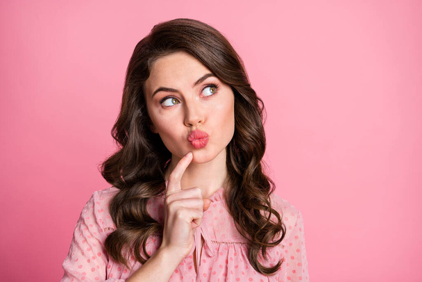 Close-up portrait of her she nice-looking attractive lovely pretty cute minded wavy-haired girl touching pouted lips overthinking clue date isolated over pink pastel color background - Фото, изображение
