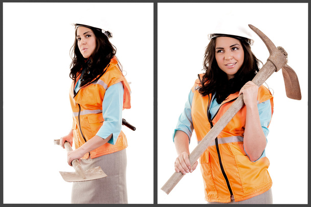 Female construction worker posing with pick axe - Foto, afbeelding
