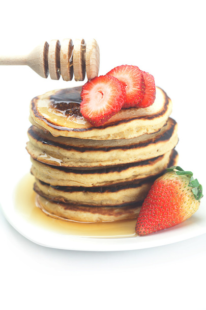 Pancakes, honey, strawberry and stick to honey isolated on white - Фото, зображення