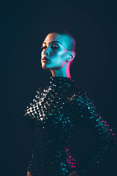 Modern beauty portrait. Young woman with shaved head. Colored gel fashion look - Zdjęcie, obraz