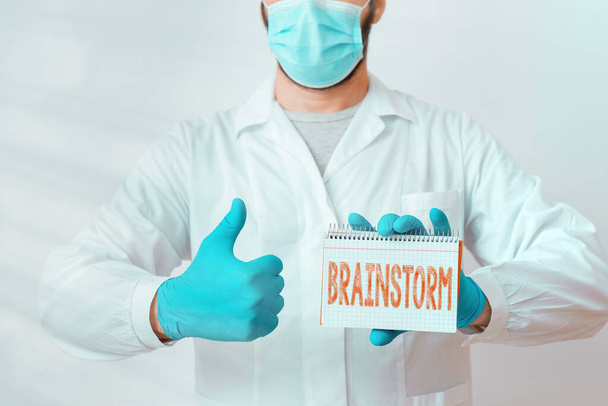 Conceptual hand writing showing Brainstorm. Business photo text solve a problem or come up with new ideas by having a discussion Laboratory Technician Featuring Sticker Paper Smartphone. - Photo, Image