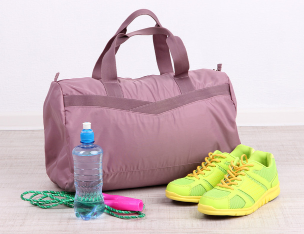 Sports bag with sports equipment in gymnasium - Fotografie, Obrázek