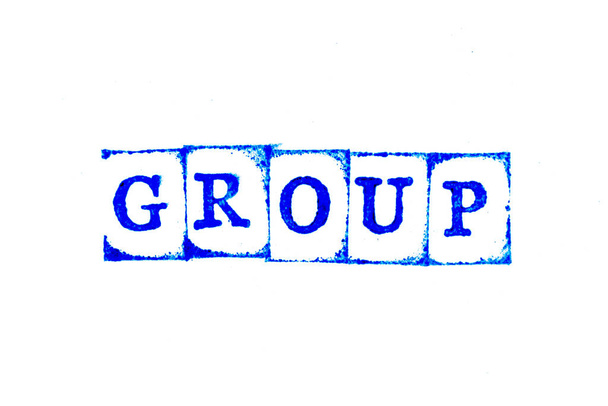 白い紙の背景に単語グループでのゴムスタンプの青の色インク - 写真・画像