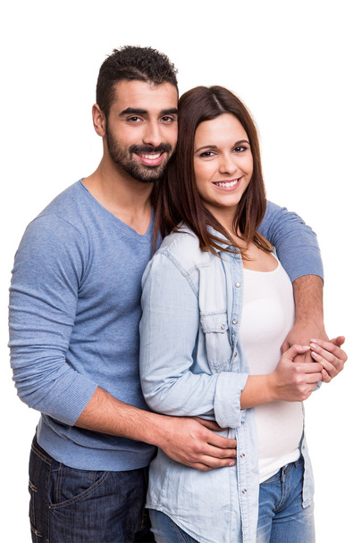 Couple posing over white background - Foto, Imagen