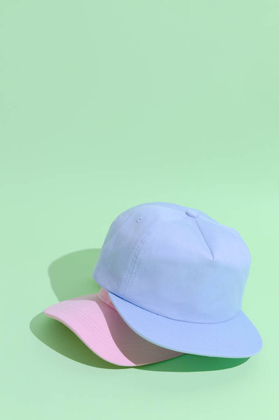Urban style flat lay outfit fashion concept. Pastel colours aesthetics.  Baseball Caps - Foto, imagen