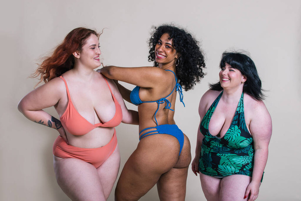 Plus size women making party at the pool - Foto, imagen