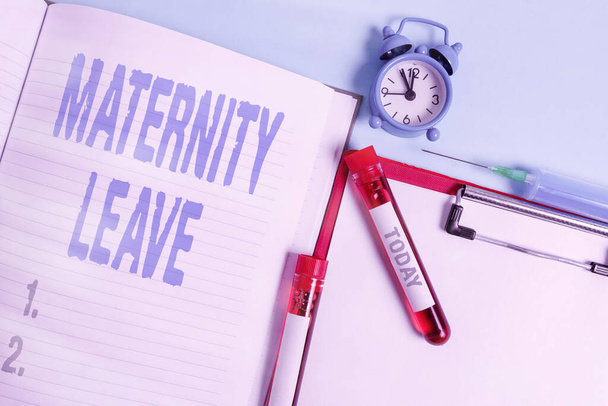 Writing note showing Maternity Leave. Business photo showcasing a leave of absence for an expectant or a new mother Blood sample vial medical accessories ready for examination. - Photo, Image