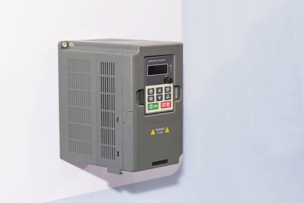 Universal inverter for electric current vector control & supply for industrial on white wall - Φωτογραφία, εικόνα