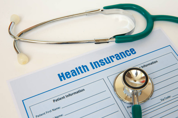 Health insurance with insurance claim form and stethoscope. Health insurance concept - Фото, зображення