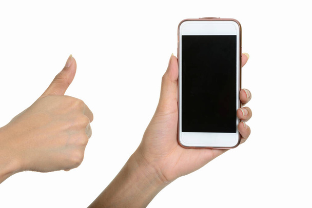 Studio shot of hand holding smart phone against white background - Фото, изображение