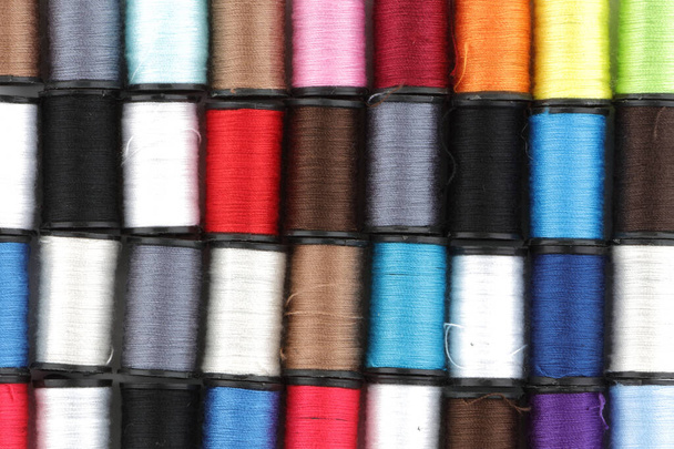 Multi colored reels of cotton background texture image - Fotoğraf, Görsel
