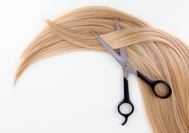 Long blond hair and scissors isolated on white - Φωτογραφία, εικόνα