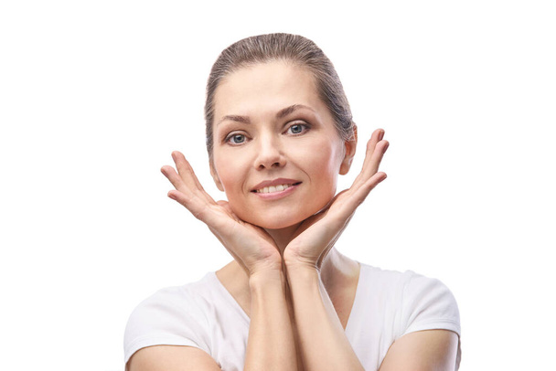 Happy pretty woman. Hands near face. Skincare concept. - Photo, image