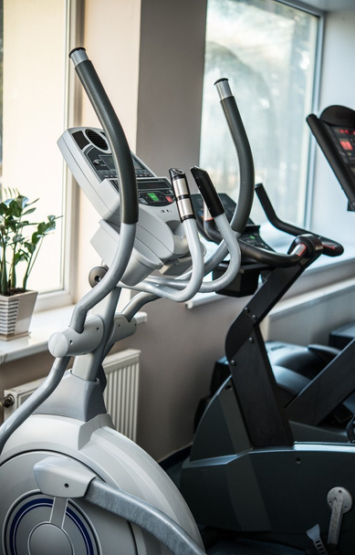 Exercise machines in a fitness club - Photo, Image