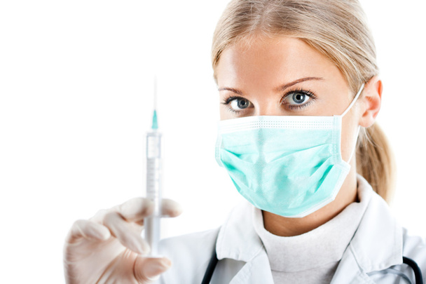 Doctor with protective mask and syringe - Zdjęcie, obraz