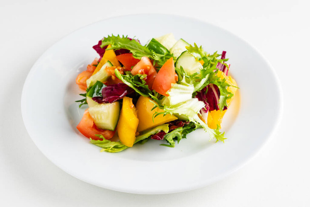 vegetable salad on the white plate - Φωτογραφία, εικόνα