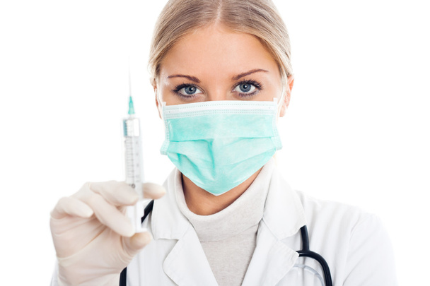 Doctor with protective mask and syringe - Foto, Bild