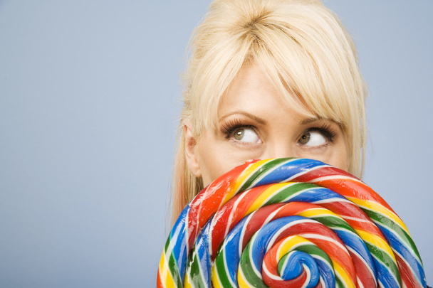 Woman with a lollipop - 写真・画像