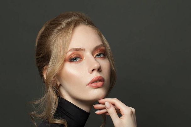 Perfect young woman with smoky eyes makeup with beige eyeshadow close up portrait - Zdjęcie, obraz