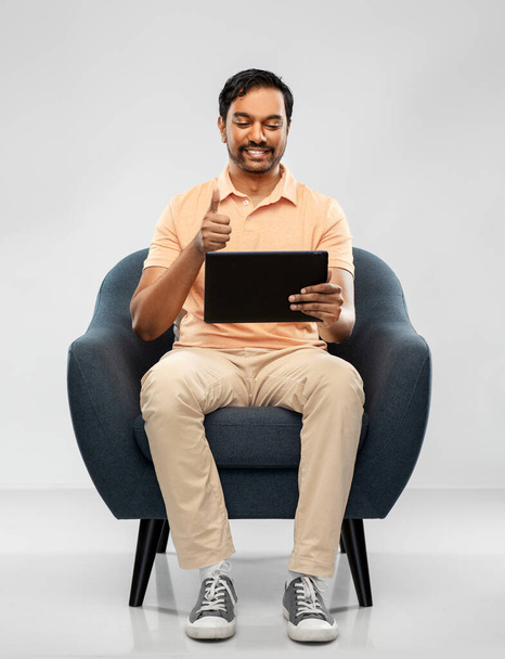 happy indian man with tablet pc showing thumbs up - Фото, зображення