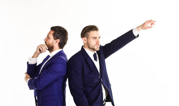 Businessmen with thoughtful faces stand back to back - Valokuva, kuva