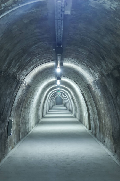 Old concrete tunnel with fluorescent lights. - Photo, Image