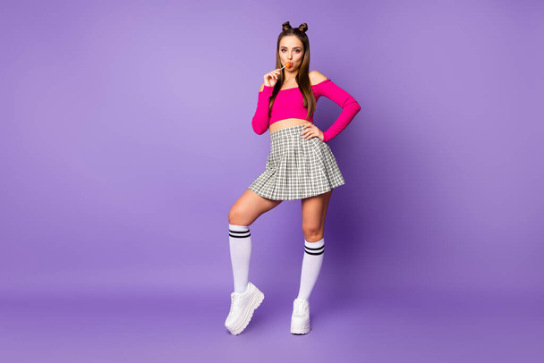 Full length body size view of her she nice attractive lovely pretty charming girlish cheerful cheery girl licking candy isolated on bright vivid shine vibrant lilac violet purple color background - Foto, afbeelding