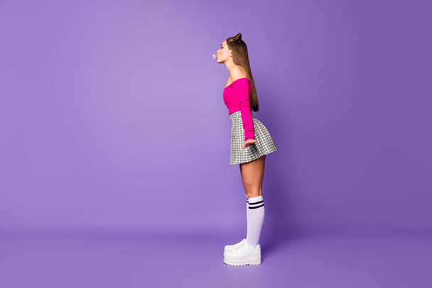 Full length body size view of her she nice attractive lovely funky cheery girl blowing bubble posing isolated on bright vivid shine vibrant lilac violet purple color background - Fotó, kép