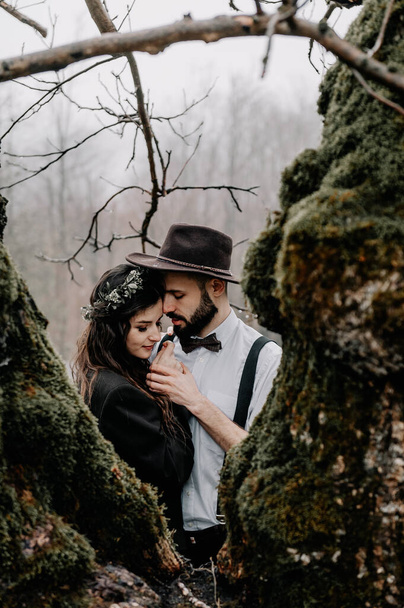 stylish young couple of brides photographed outdoors in the mountains  - Photo, Image