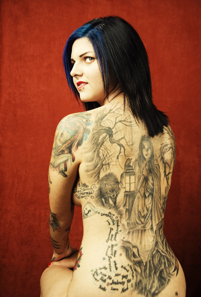Woman with a tattoo on her back - Zdjęcie, obraz